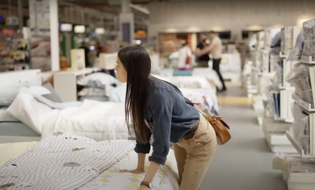 A-woman-shops-for-a-mattress